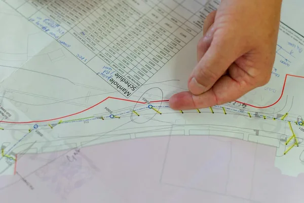 Architect reviewing architectural blueprint