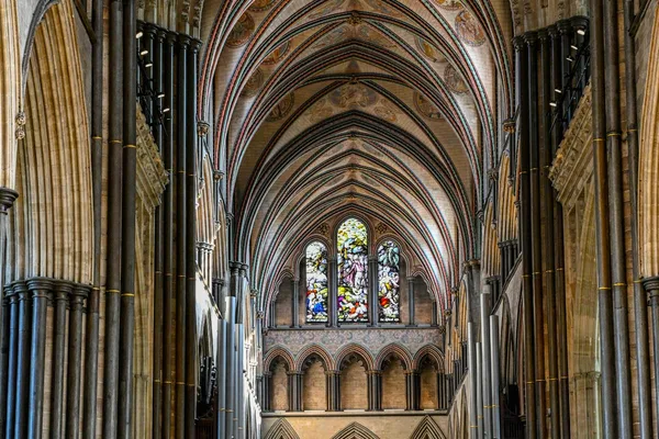 Gothic cathedral nave interior with stained glass windows